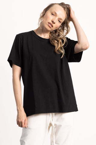 blond female model wearing a black pima cotton t shirt