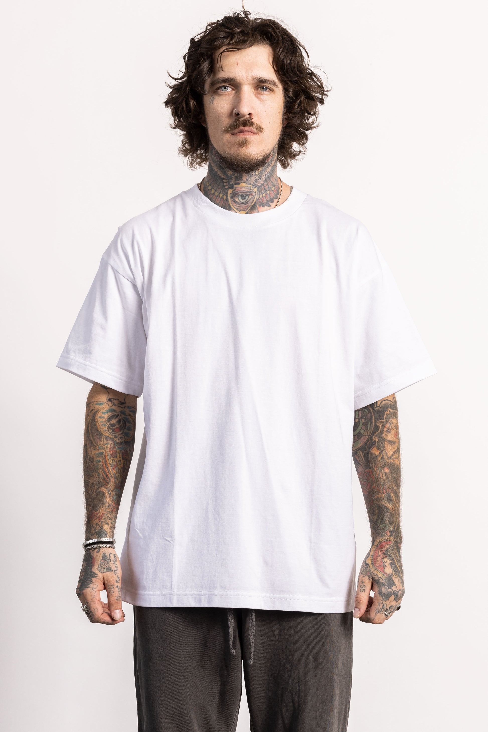 White male model with edgy style wearing a heavyweight cotton Classic Fit T-shirt.