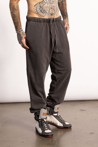 White edgy male model wearing a oversized sweatpants