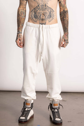 White edgy male model wearing a oversized sweatpants