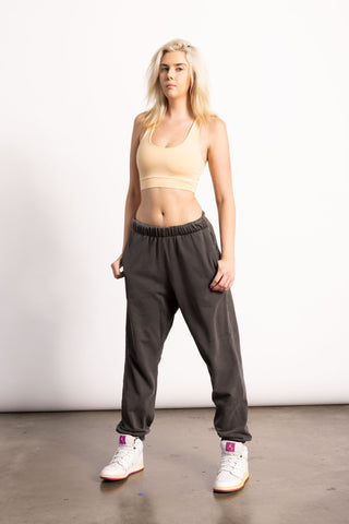 Blonde female model wearing oversized sweatpants