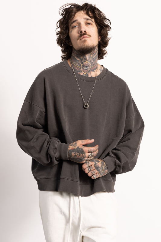 male white edgy model wearing an oversized sweatshirt