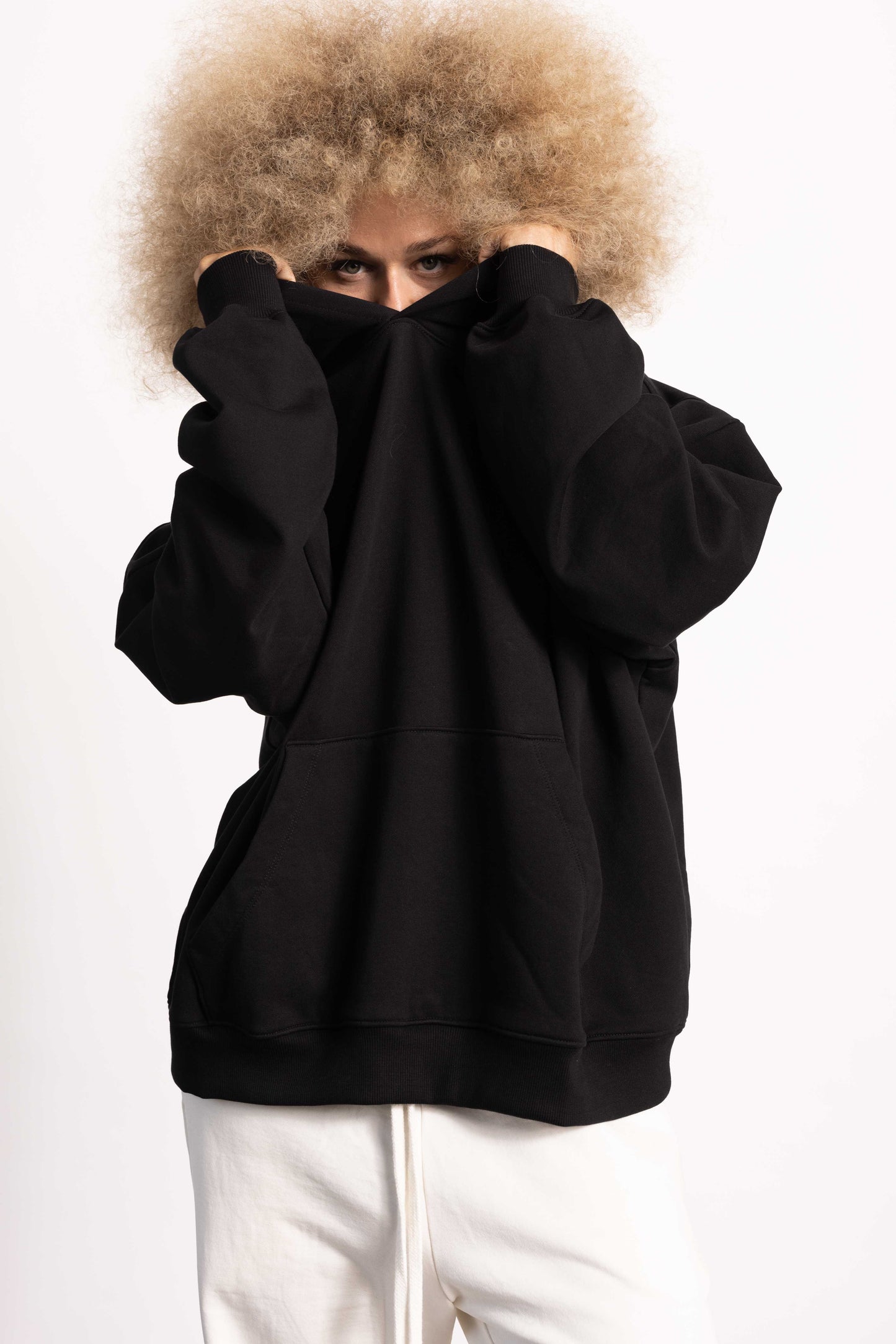 White female model wearing a Drop Shoulder Pima Cotton Hoodie