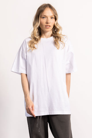 blonde female model wearing a white oversized tee